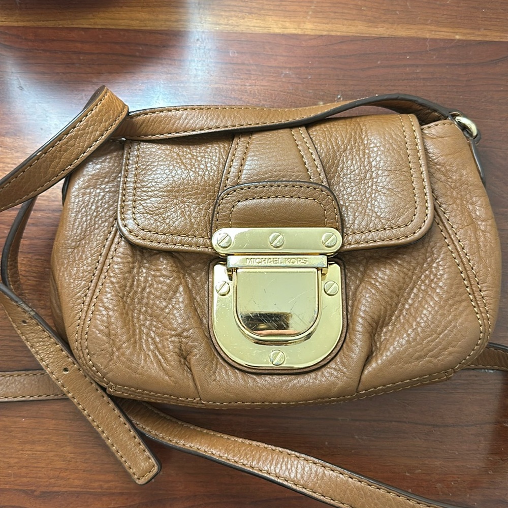 Brown leather Michael kors cross body purse with gold hardware